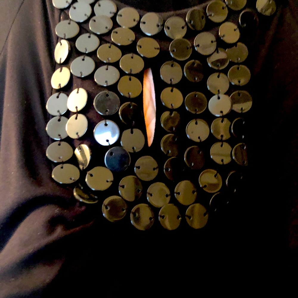 Black shirt with black bead. 3/4 length sleeve